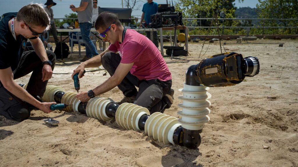 JPL robotics team working with EELS prototype at Mars Yard